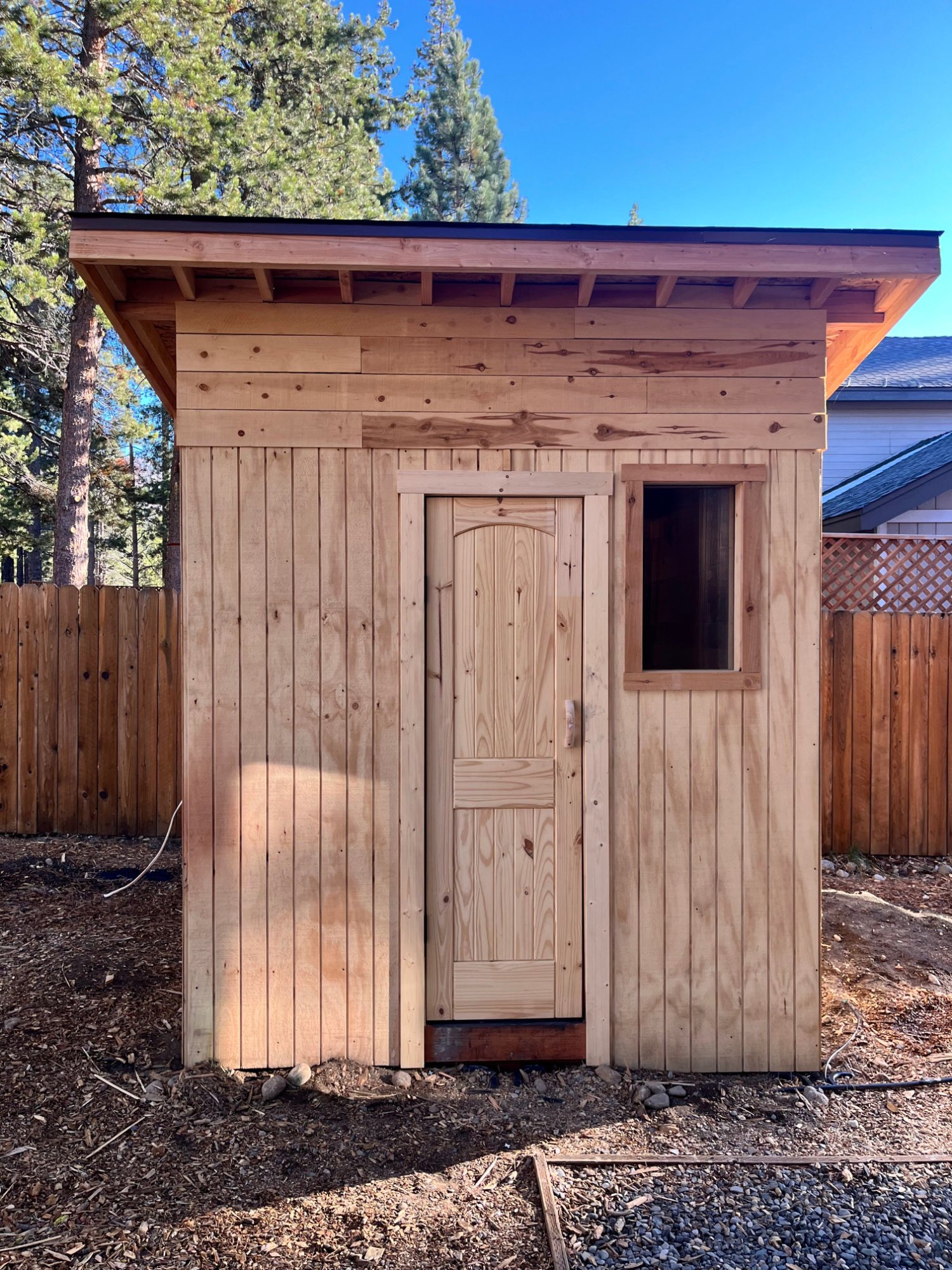 8x8 backyard sauna with redwood benches in South Lake Tahoe